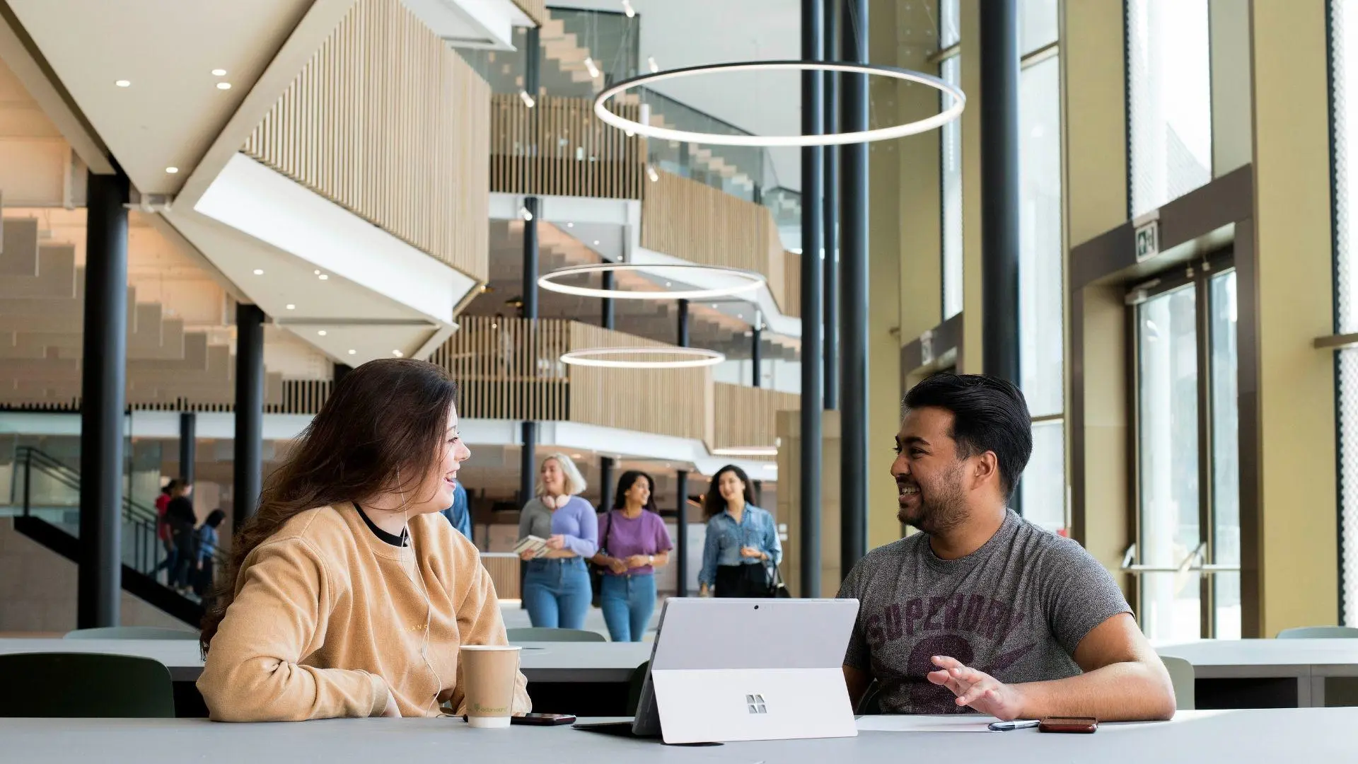 students sat on table discussing