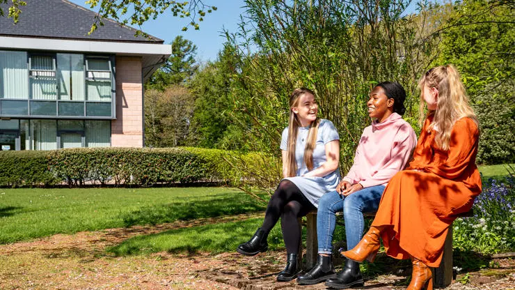 Students enjoying the sun on Westlakes Campus