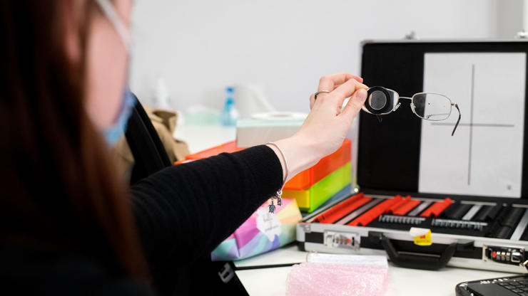 Student using eye test equipment 