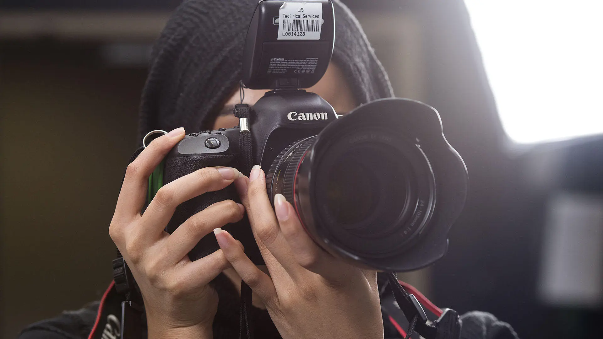 person behind a camera taking a picture