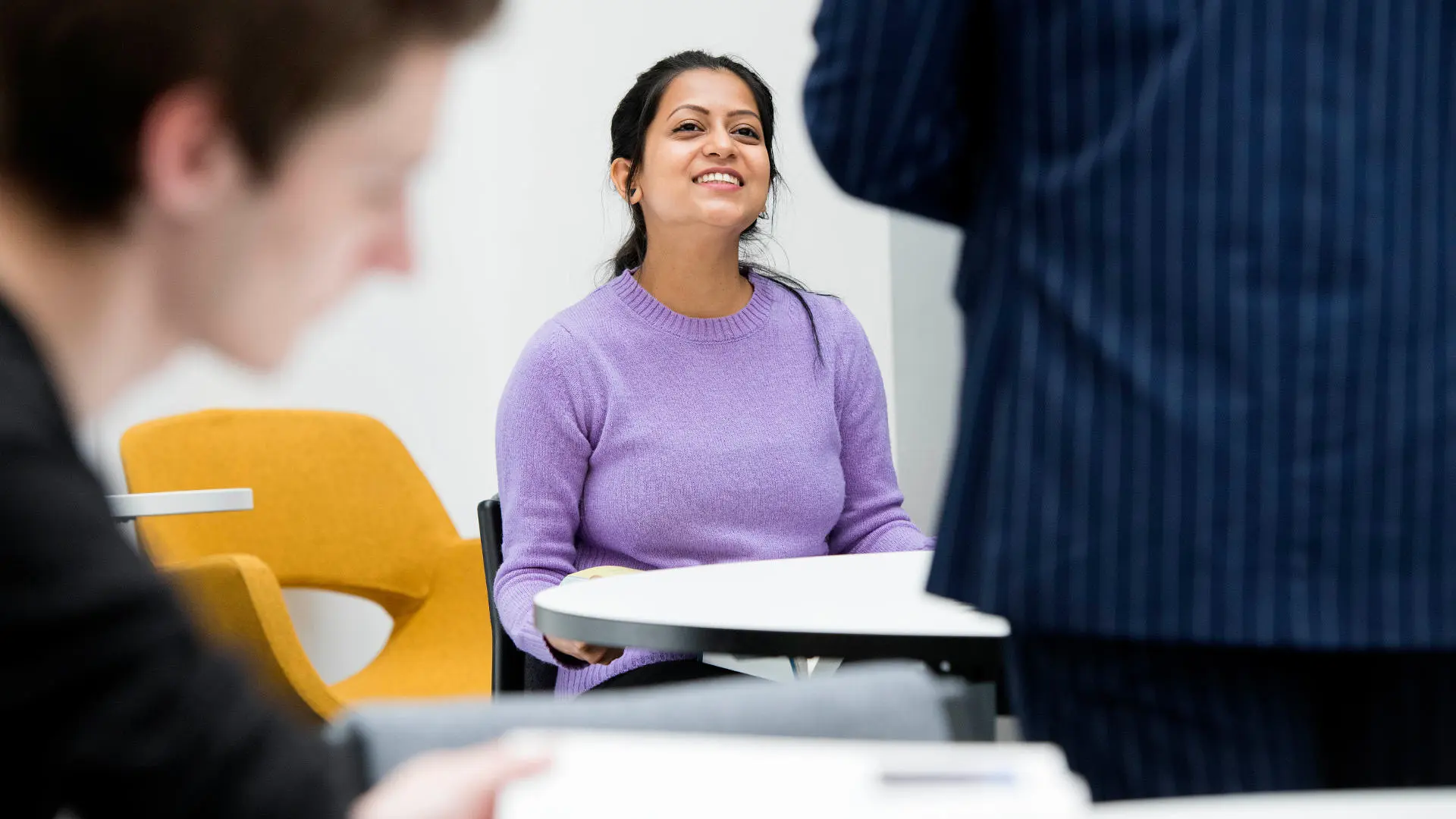 student sat smiling