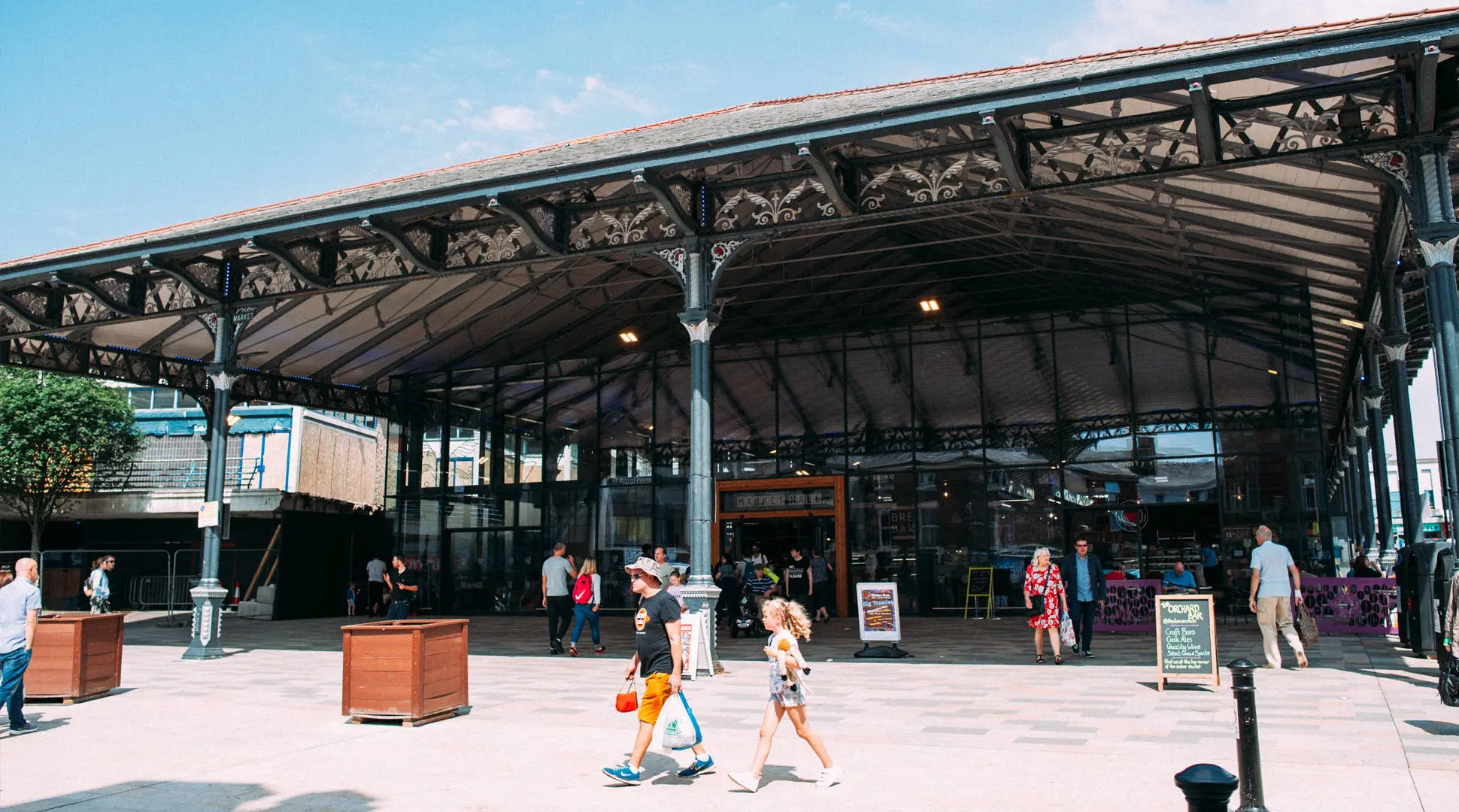 shoppers walking outside preston market hall