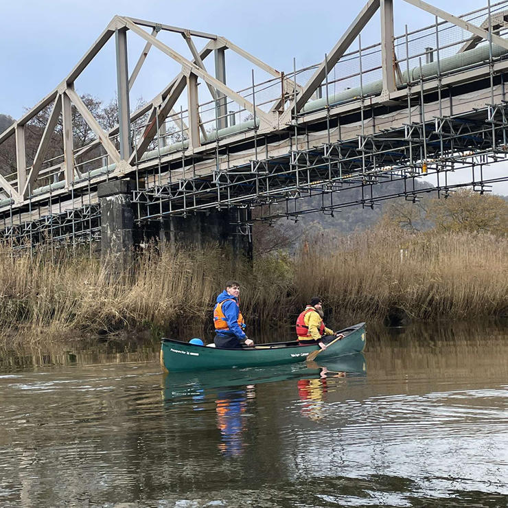 In North Wales, students canoed under the Dolgarrog pipe bridge.