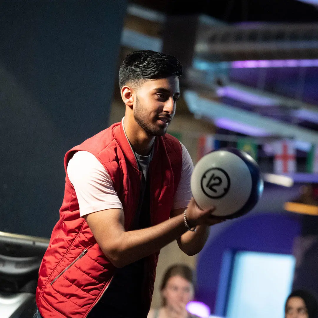 Student preparing to bowl at Level entertainment venue in Preston