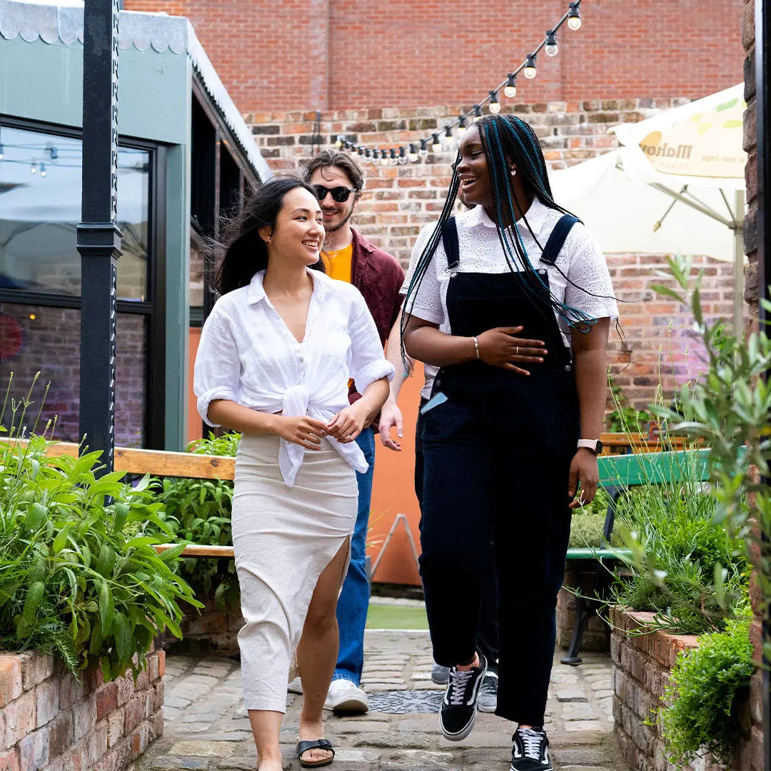 Students walking into restaurant and bar in Preston