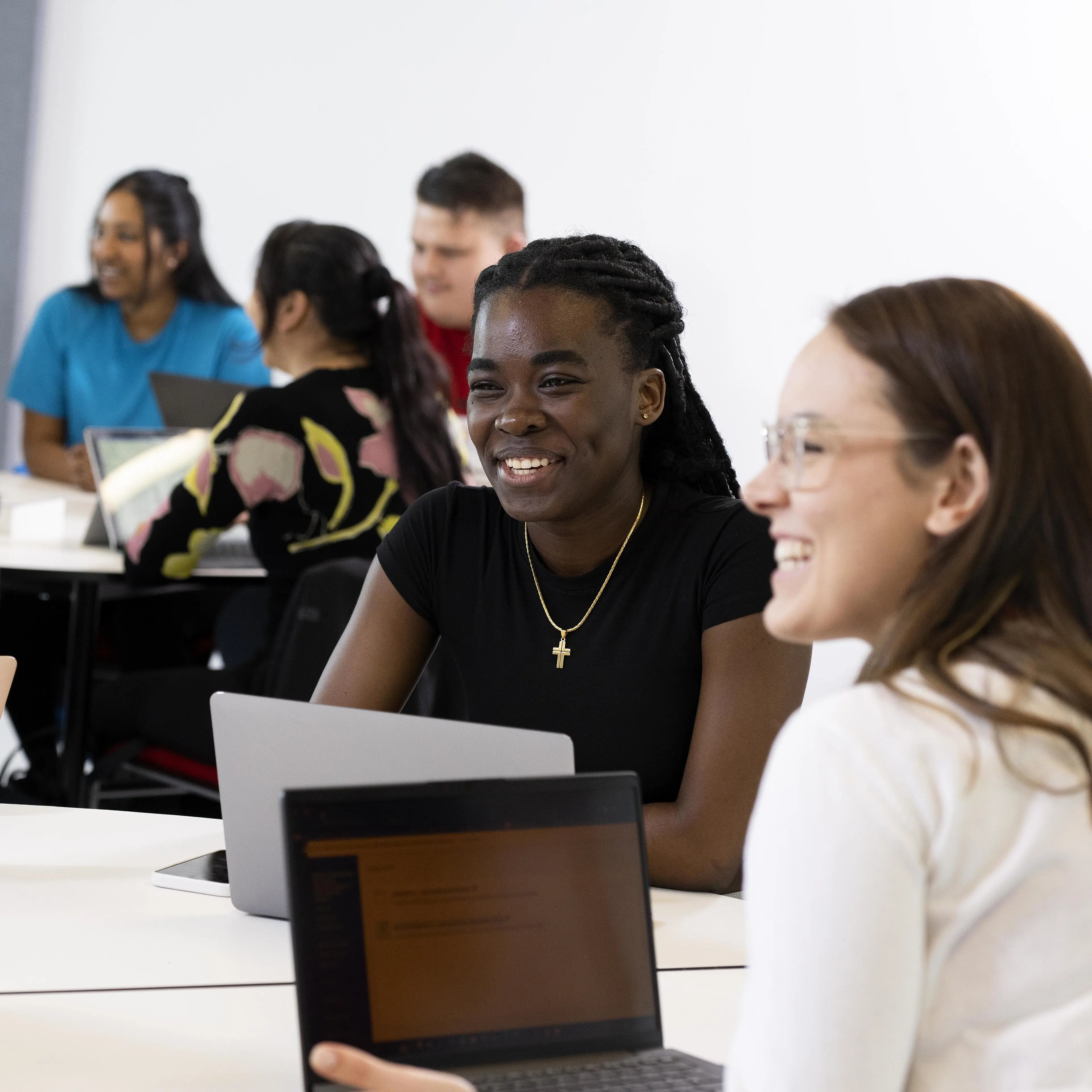 students in classroom chatting