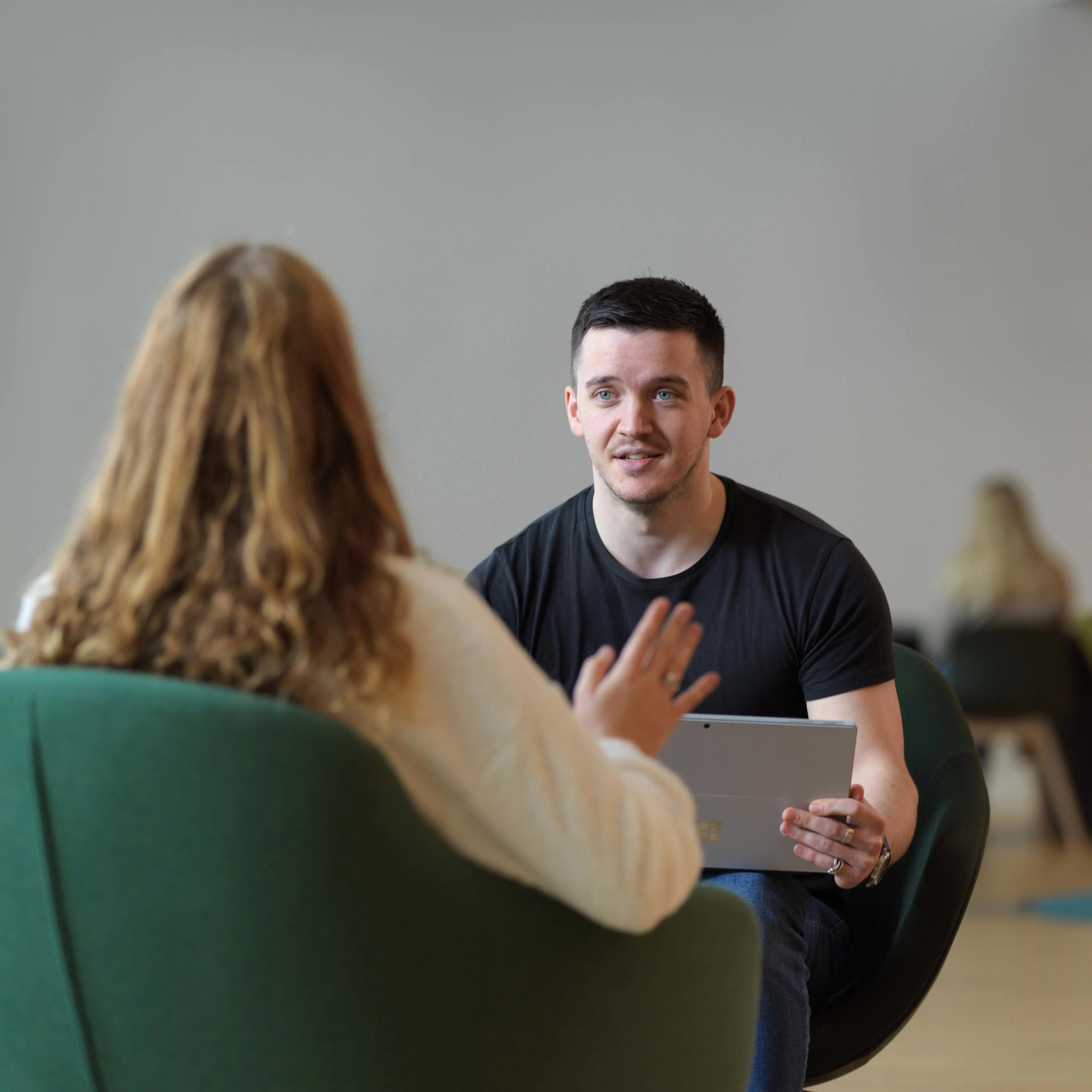 Member of staff talking to a student about support