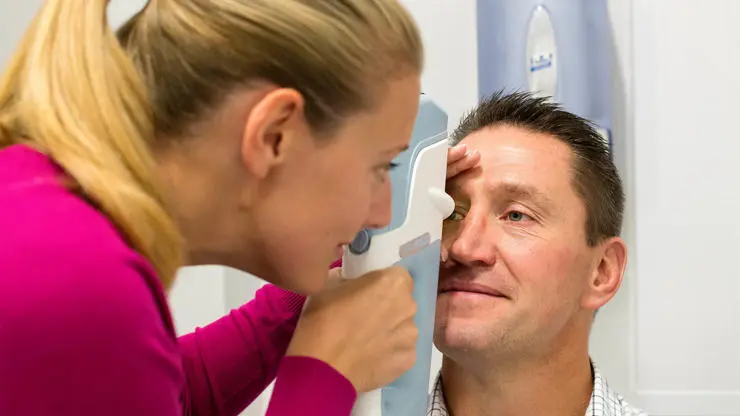 Student taking a close-up view during an eye examination.