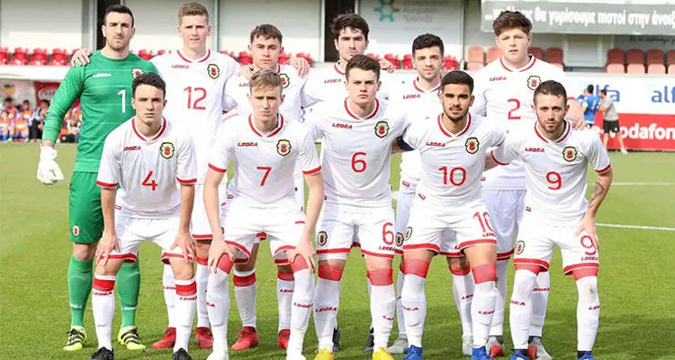 The team pose for a photo before the match
