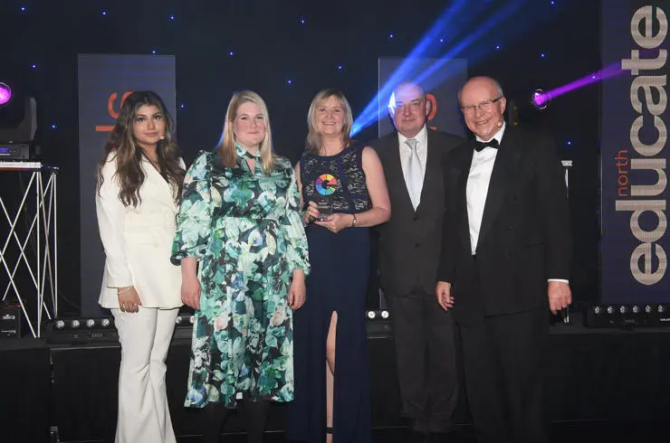 Dr Liz Granger (second left) and Ginette Unsworth (centre) receive the External Relations award from Educate North representatives