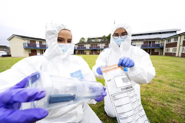 Evidence retrieval on the grassy area outside the flats