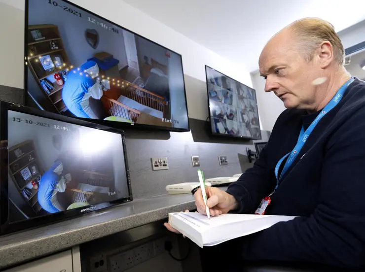 Paul Callaghan watching the students in the observation room